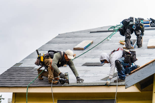 Professional Roofing technician working in East Marion, NY